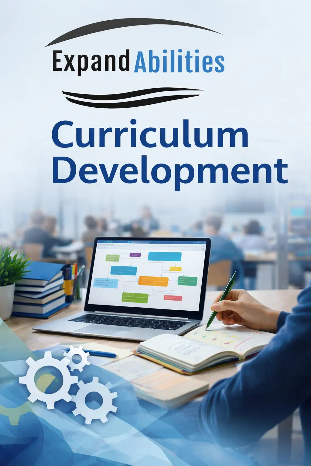 Curriculum development workspace with laptop and books.